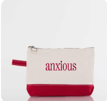 Canvas pouch with red bottom half and 'anxious' text on a white background